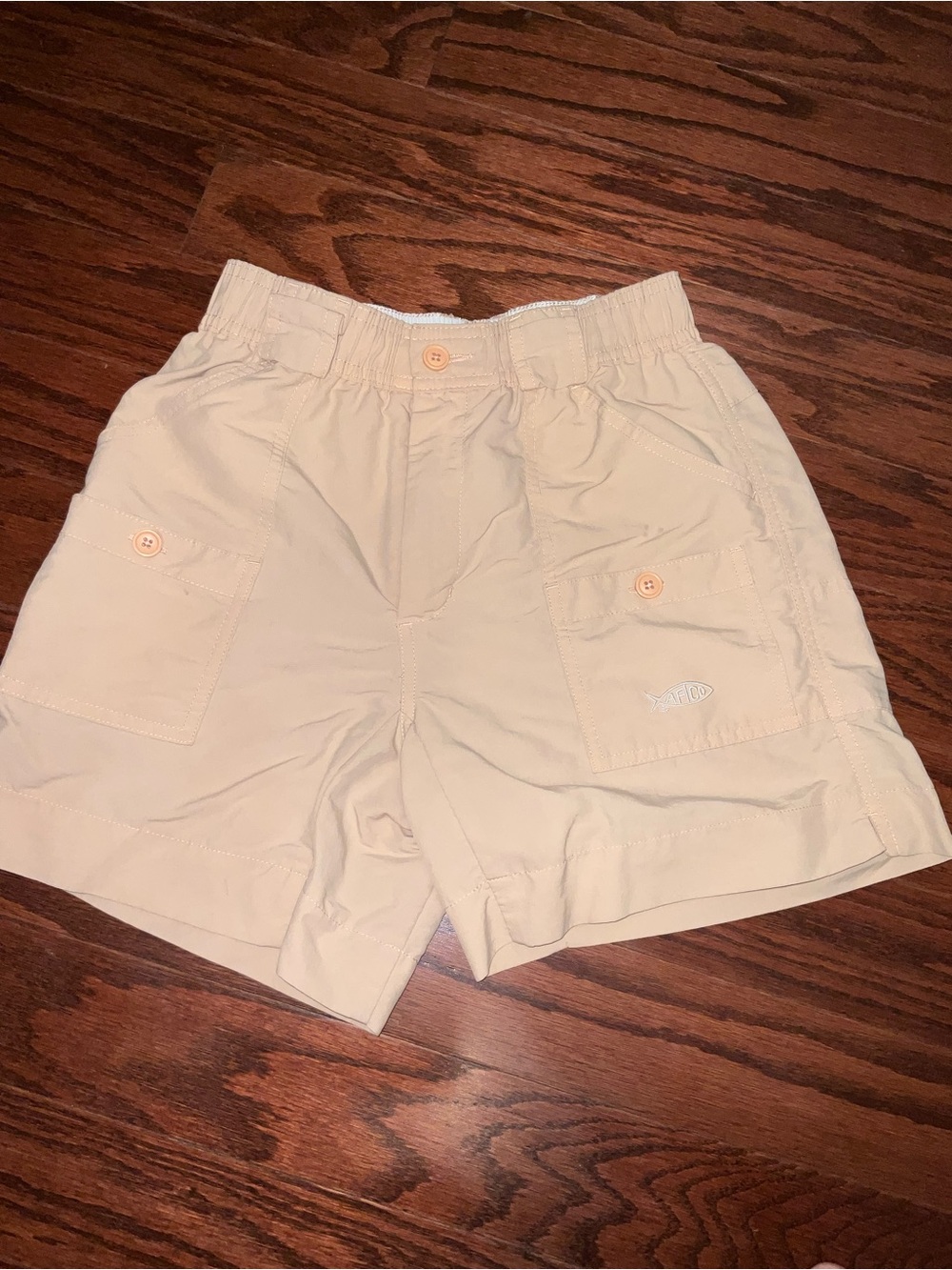Light orange Aftco Shorts.